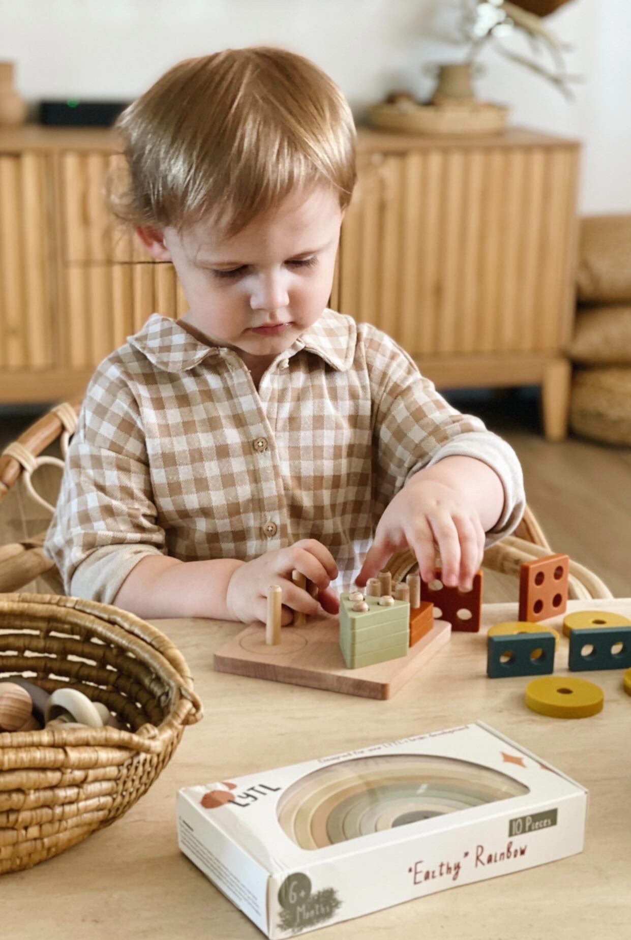 Zaiah a 2 year old playing with Lytl's Montessori Wooden Puzzle Toy