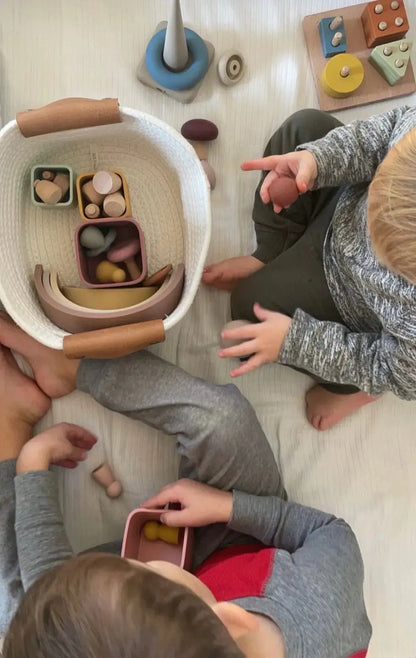 Montessori toy bundle with silicone stacking cups, rainbow stacker, puzzle, mini peg dolls, mushroom toy, and ring stacker. Silicone and Wooden Childrens toys for development and fine motor skills.