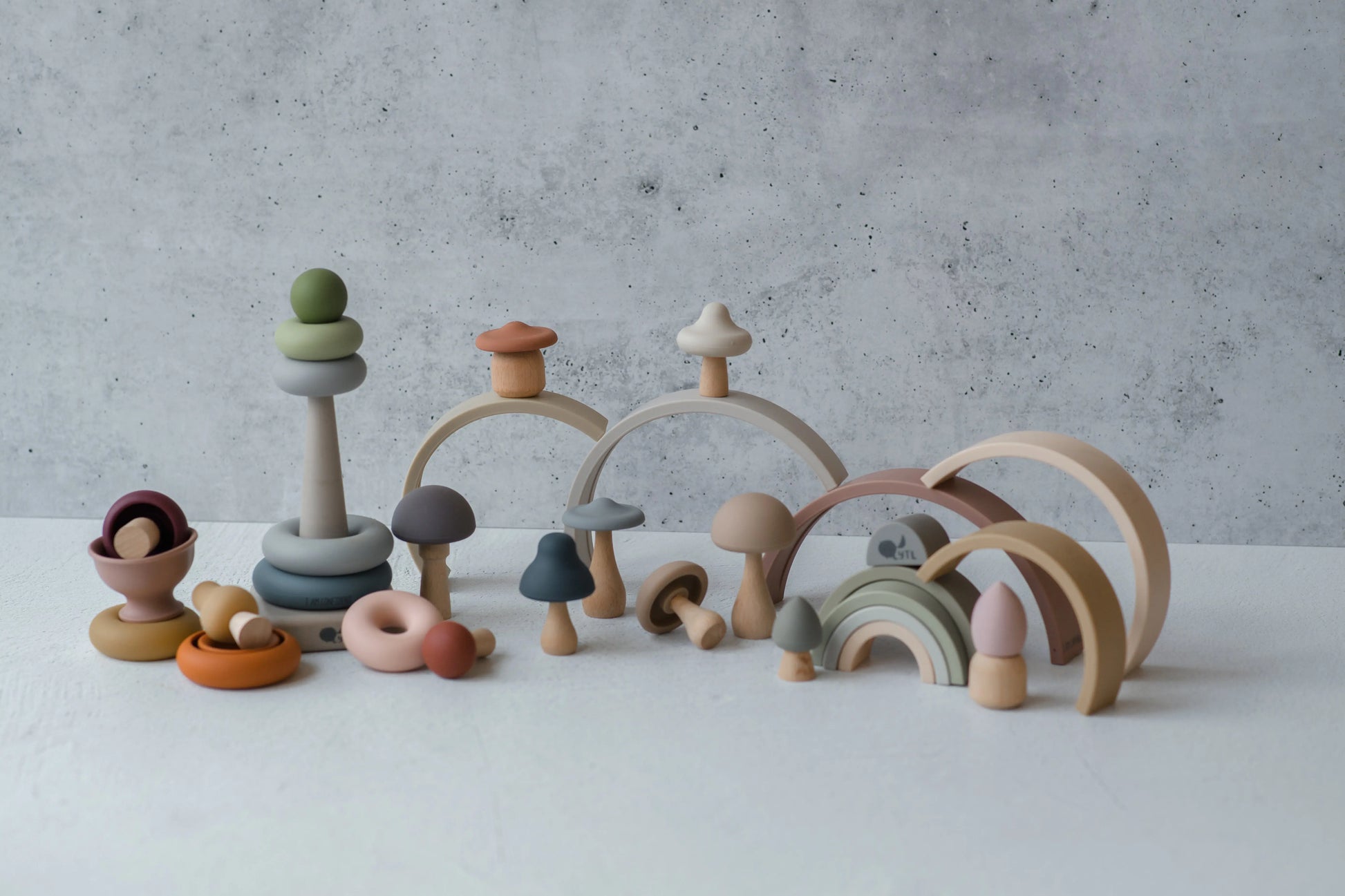 My First Christmas Play Bundle - Close-up of silicone stacking rings and mushroom teether in holiday gift set