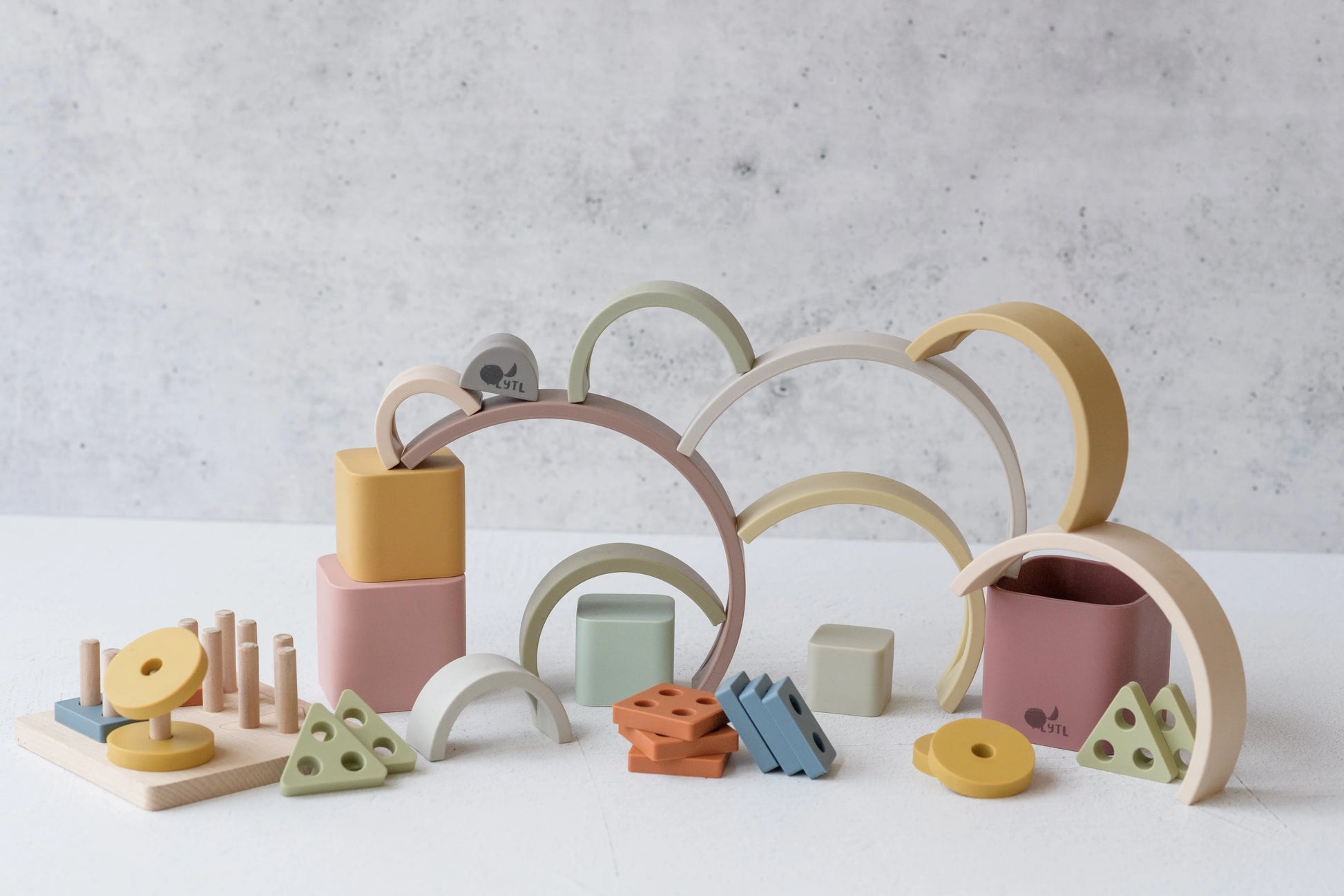 Shape puzzle toy from Jingle & Grow Play Kit — fine motor practice