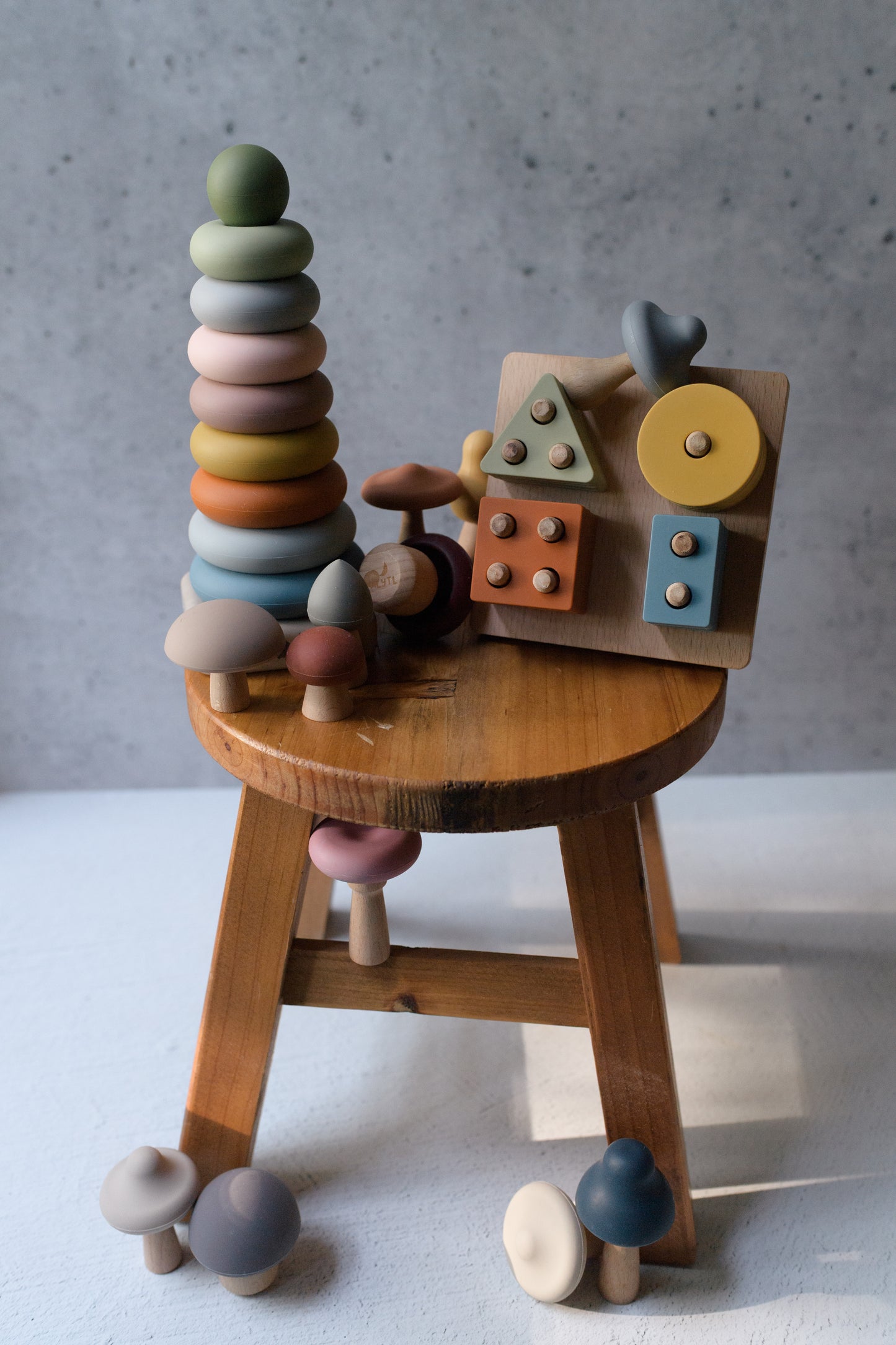 Fine Motor Play Bundle with shape puzzle, mushroom matching toy, and ring stacker for ages 3+