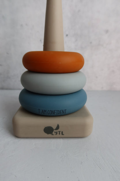 Montessori baby toy with positive affirmation message and stacking rings for confidence building