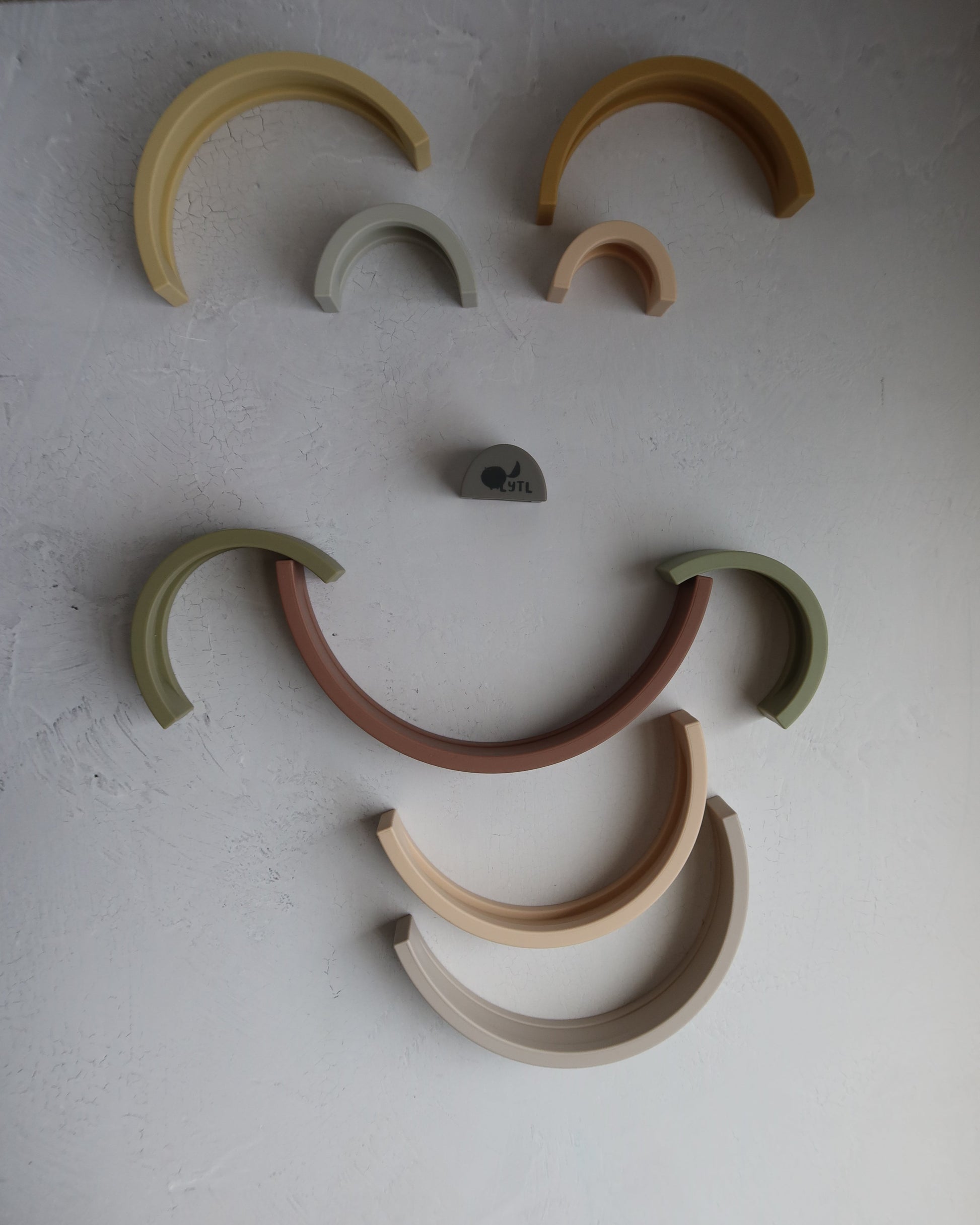 Montessori-inspired earthy silicone rainbow stacking toy for early childhood development and sensory exploration