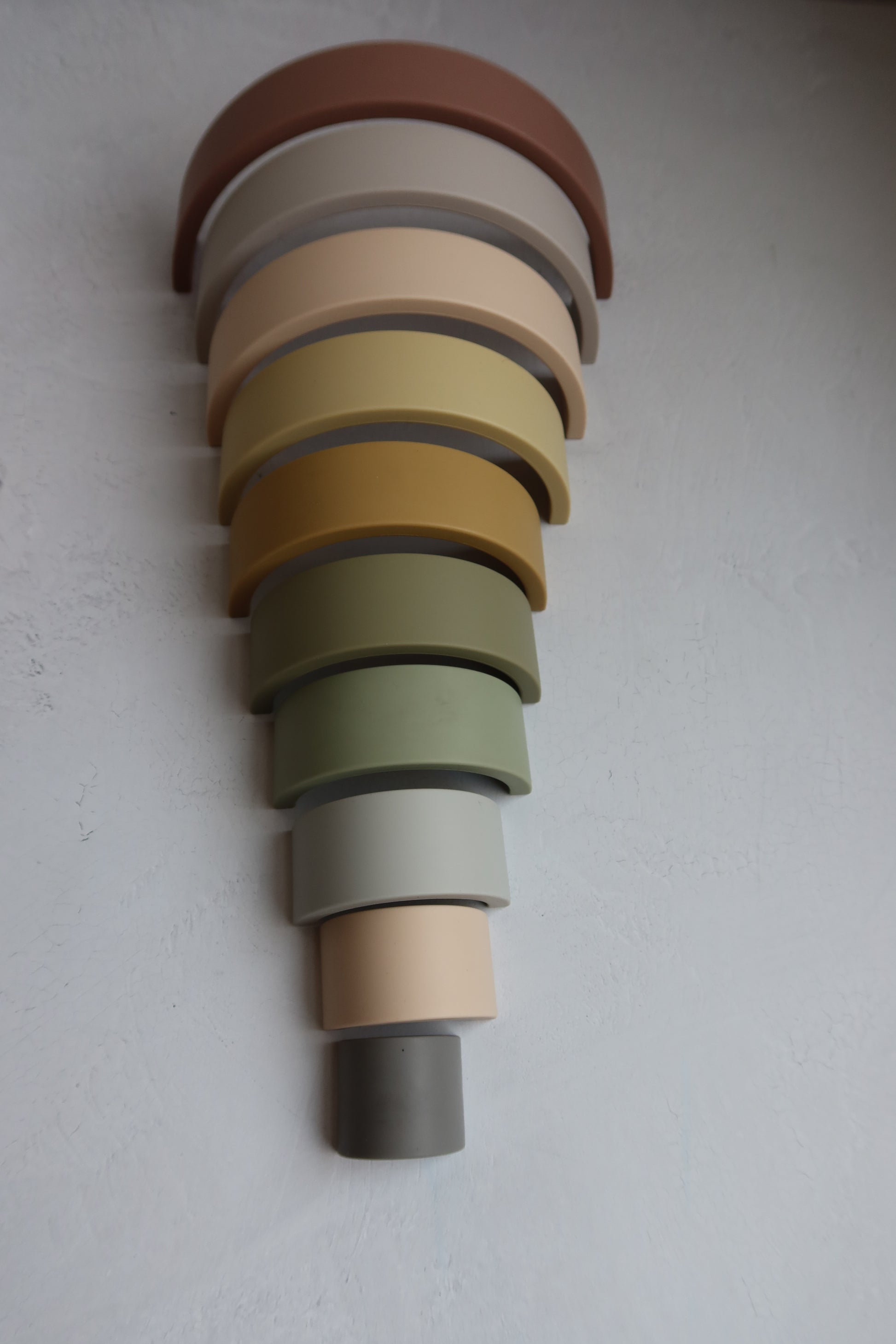 Montessori 10 layer silicone rainbow stacker in earthy neutral colors for babies and toddlers – open-ended toy for fine motor skills and creative play