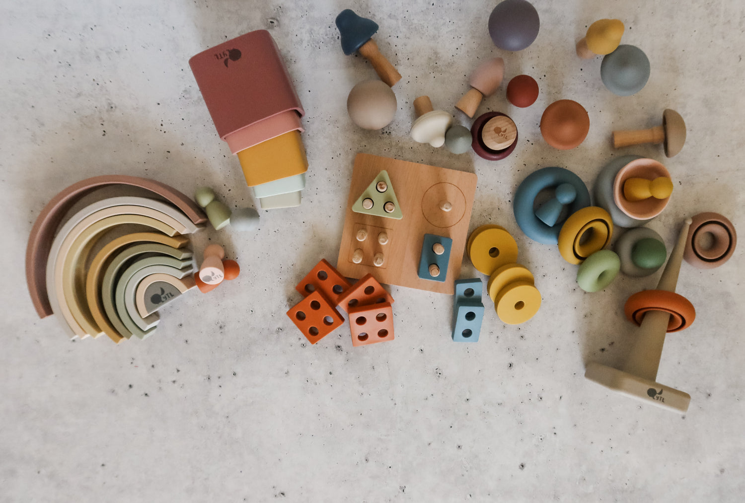 Montessori toy bundle for toddlers with silicone stacking cups, rainbow stacker, shape puzzle, mini peg dolls, mushroom toy, and ring stacker