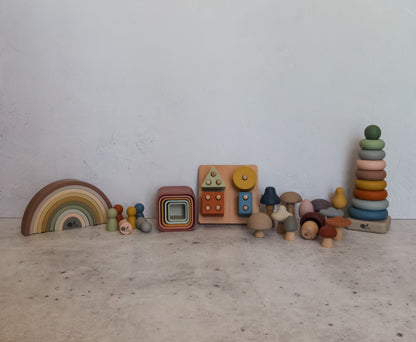 Montessori toy bundle with silicone stacking cups, rainbow stacker, puzzle, mini peg dolls, mushrooms, and ring stacker