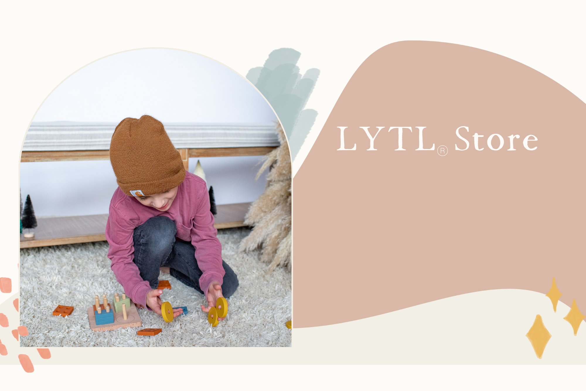 Toddler solving shape puzzle on quilted cotton play mat with rainbow stacker — Montessori holiday gift set - Lytl toys